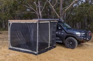 SUV with awning tent installed on the side