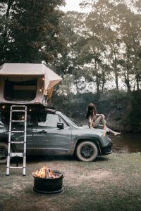 SUV with rooftop tent installed on top