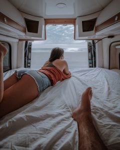 Camper van with cabinets installed around the upper portion